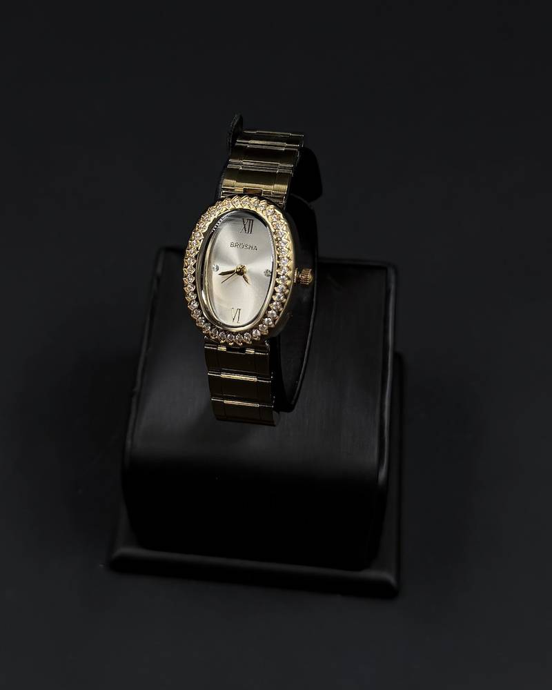 An oval-shaped watch surrounded by crystal