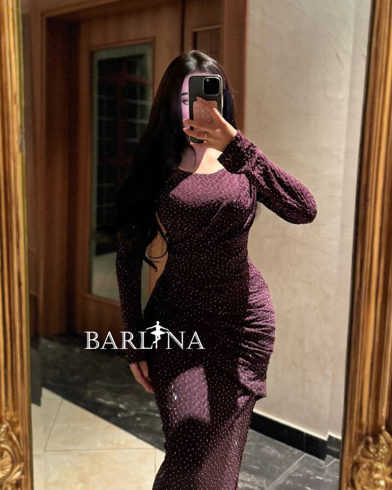Long, fitted dress with delicate embroidery