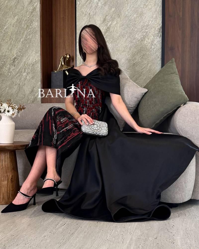 Black evening dress with a tail in the back