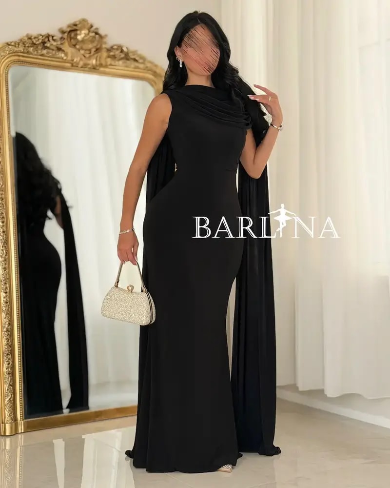 A soft black dress with a luxurious side sash.