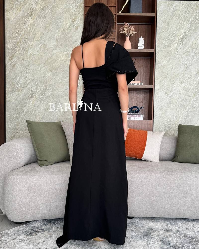 Black off shoulder dress embroidered with stones