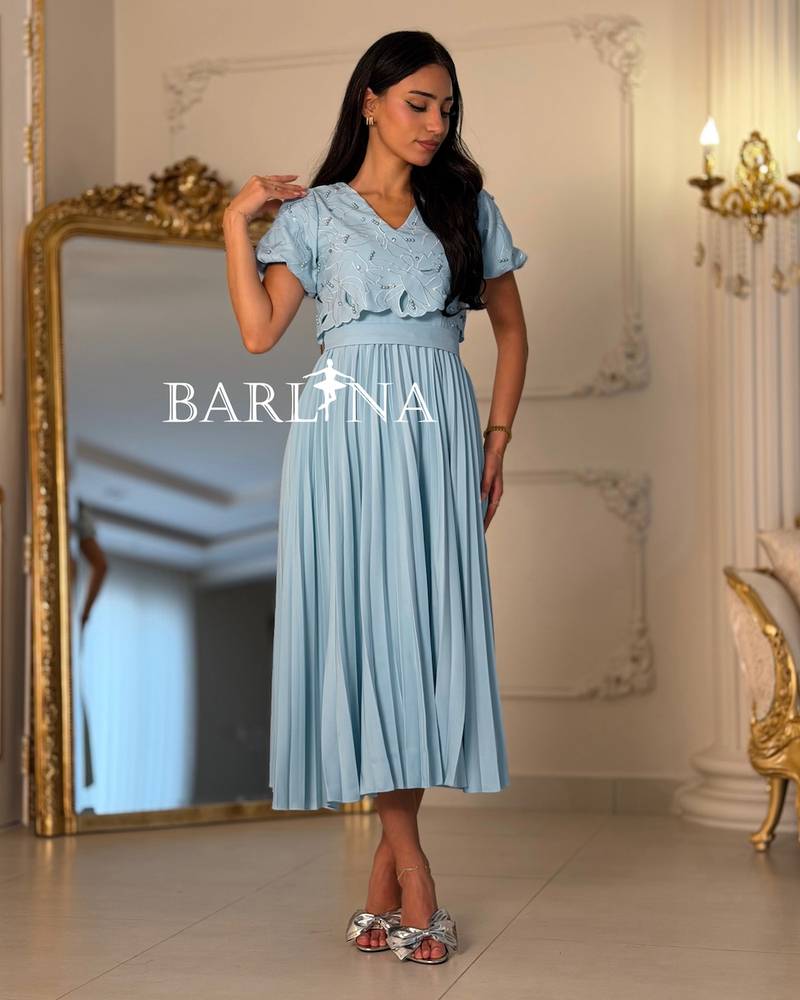 Sky blue pleated dress with short puffed sleeves