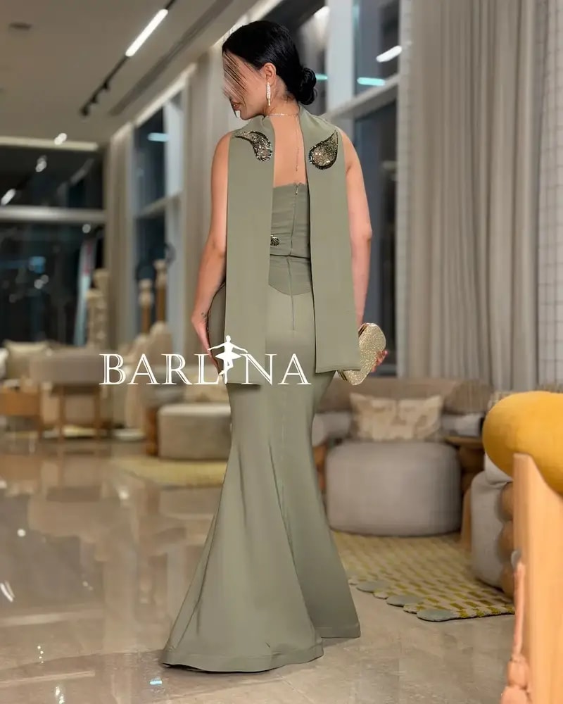 Olive green dress with shimmering bead embroidery