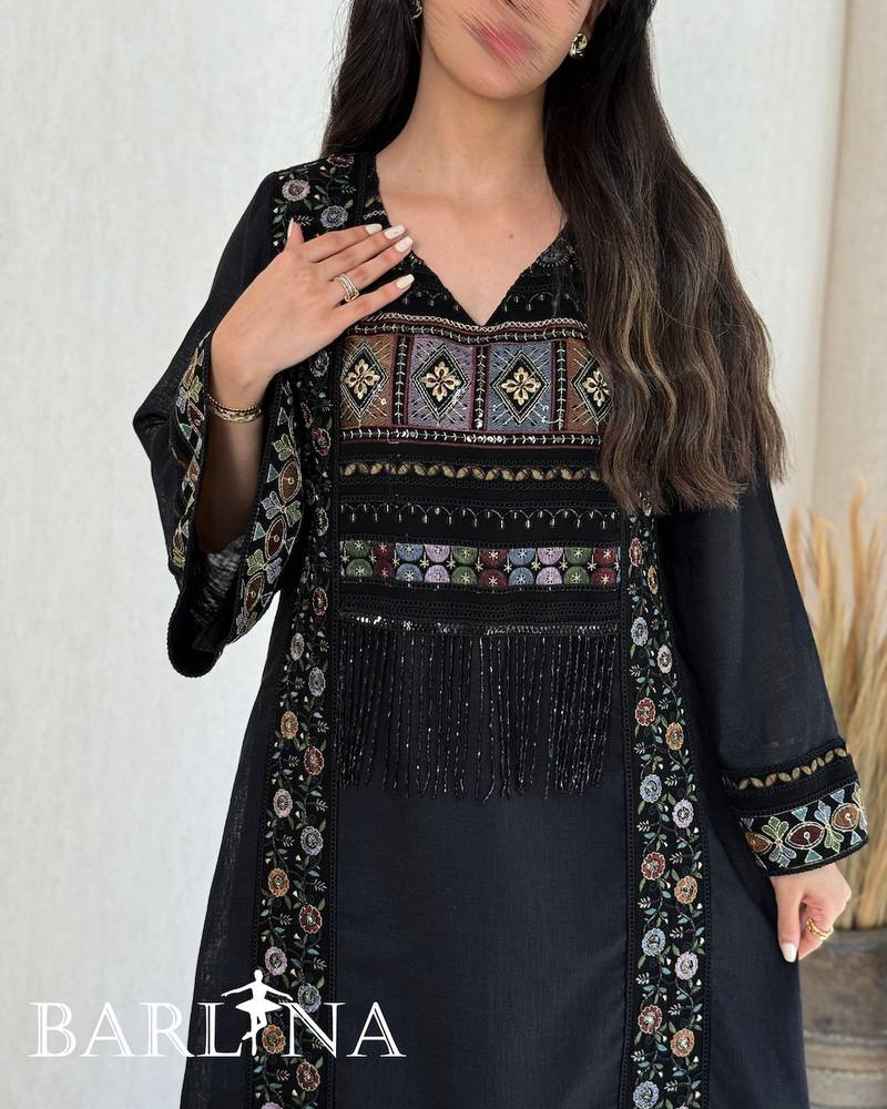 A soft black jalabiya with embroidered edges