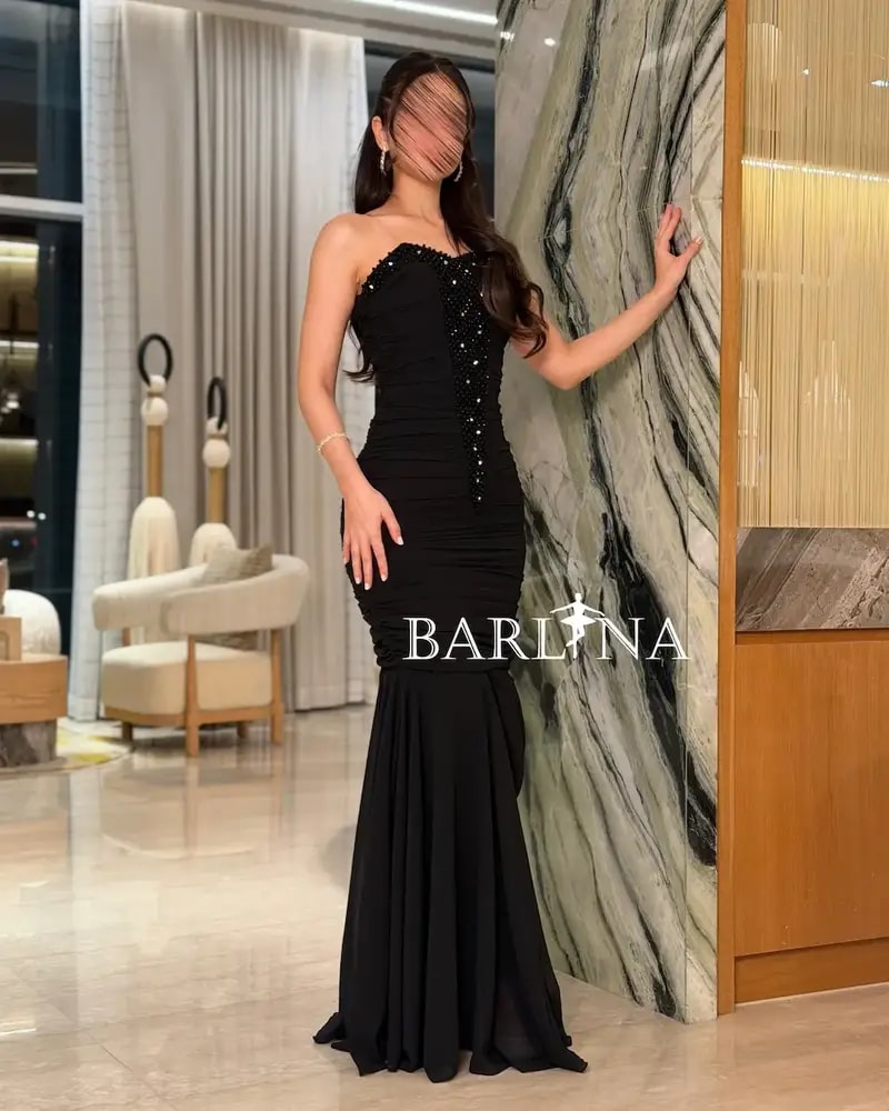 Black ruffled dress with crystal embroidery