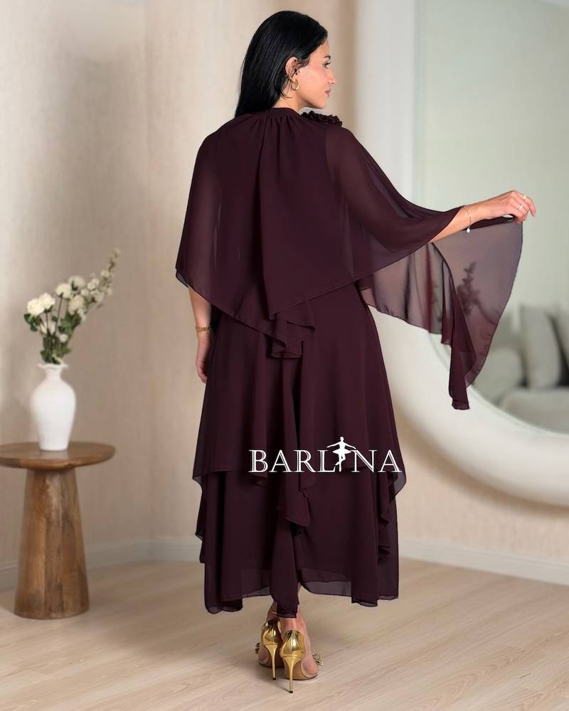 vinous wide dress with layers and cape sleeves