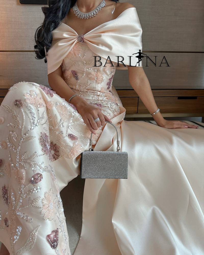 Cream evening dress with an elegant back bow