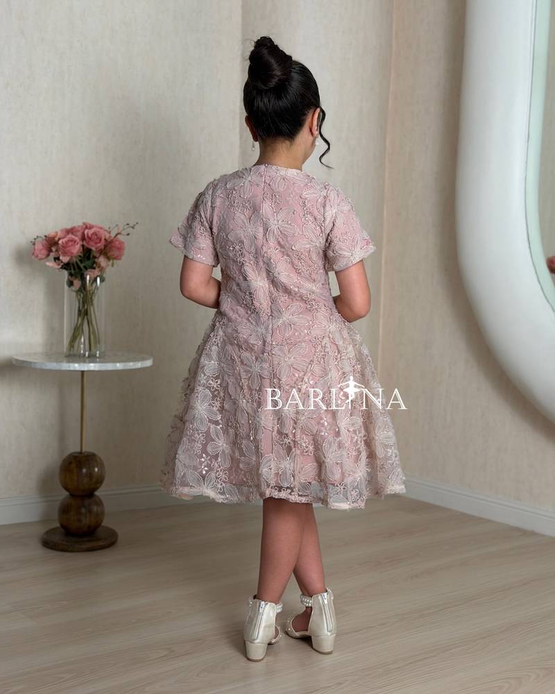 Pink girls' dress with a sheer overlay decorated with roses