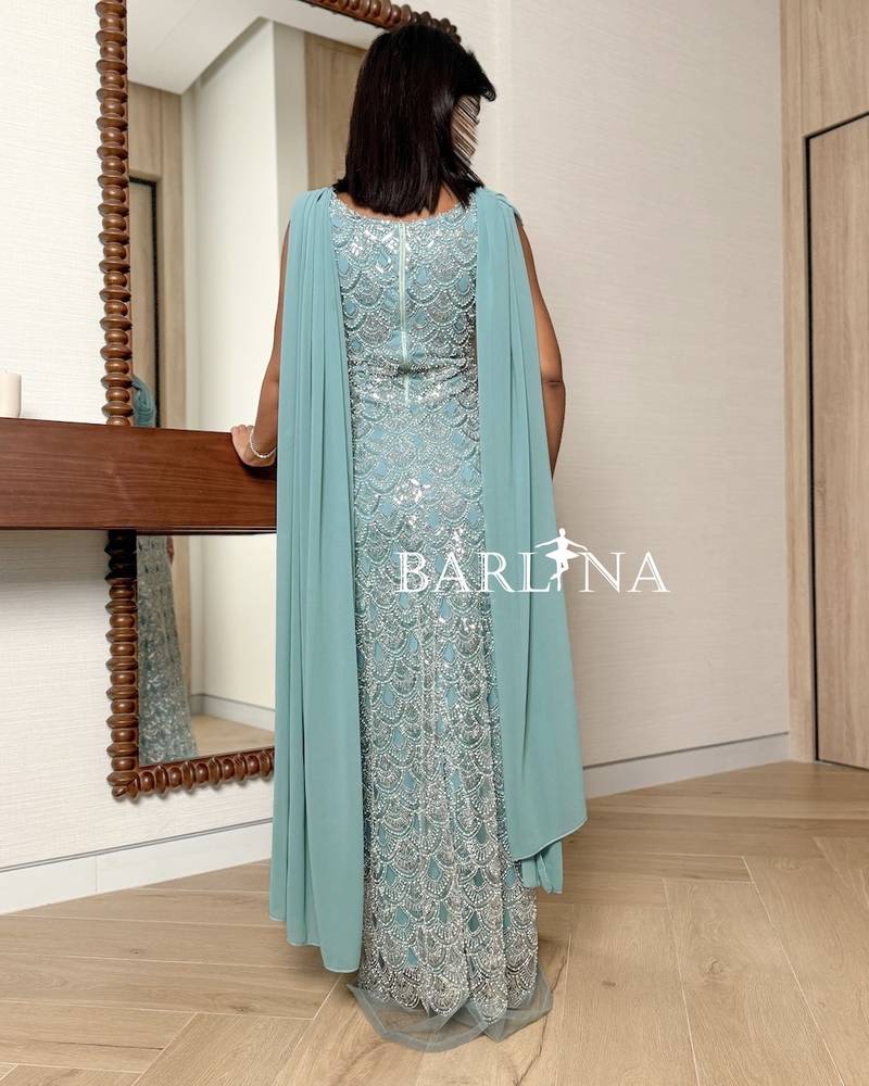 Ice blue dress with wave-shaped embroidery
