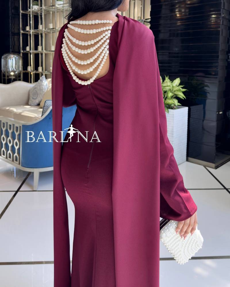 Elegant burgundy dress decorated with pearls on the back