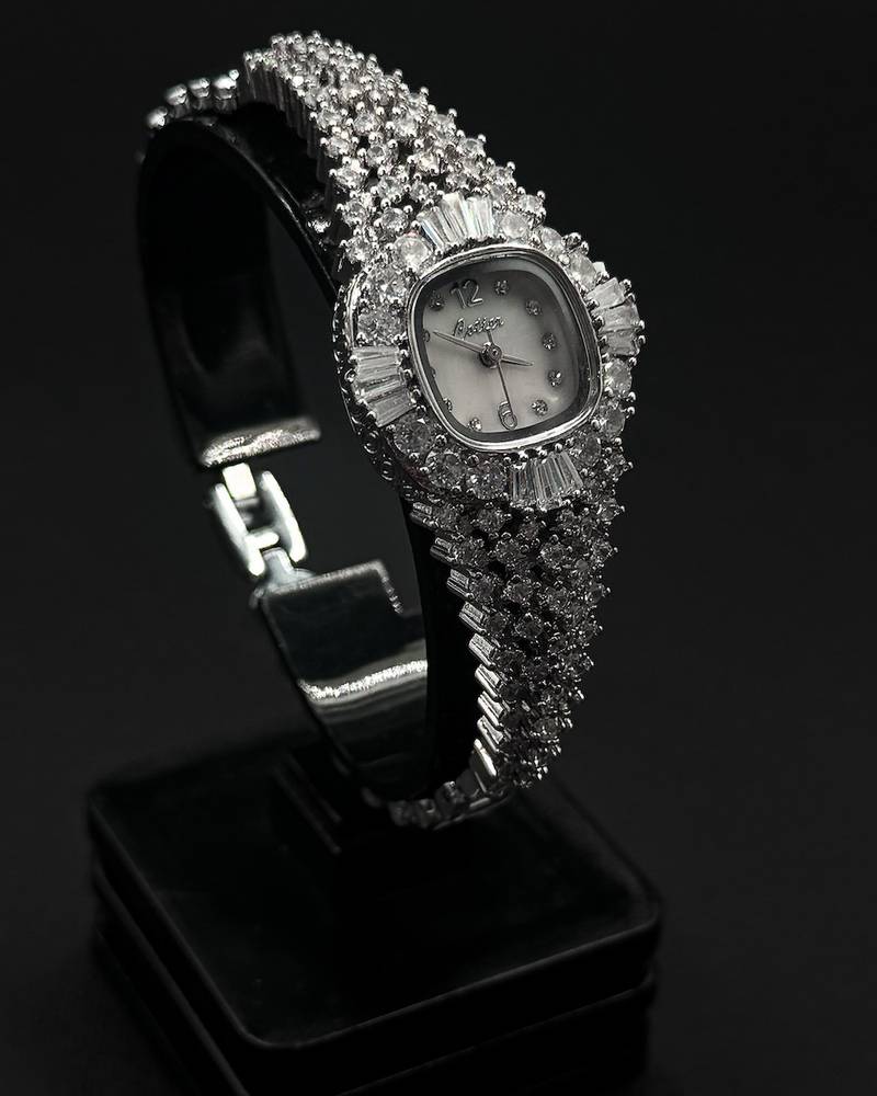 A luxury wristwatch fully encrusted with sparkling stones