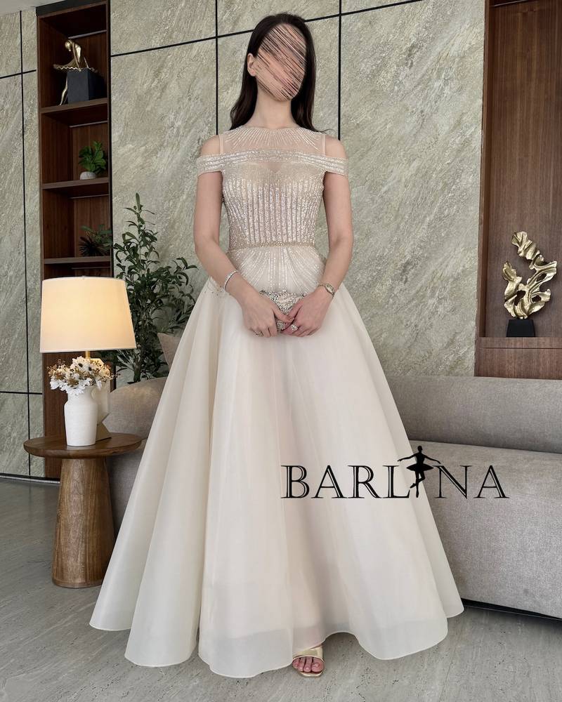 Light beige evening dress with royal embroidery