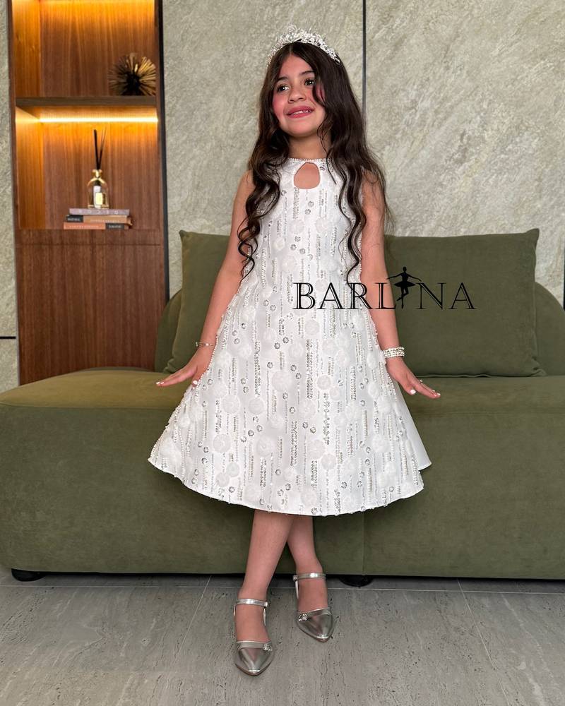 Girls' white dress with shiny embroidery