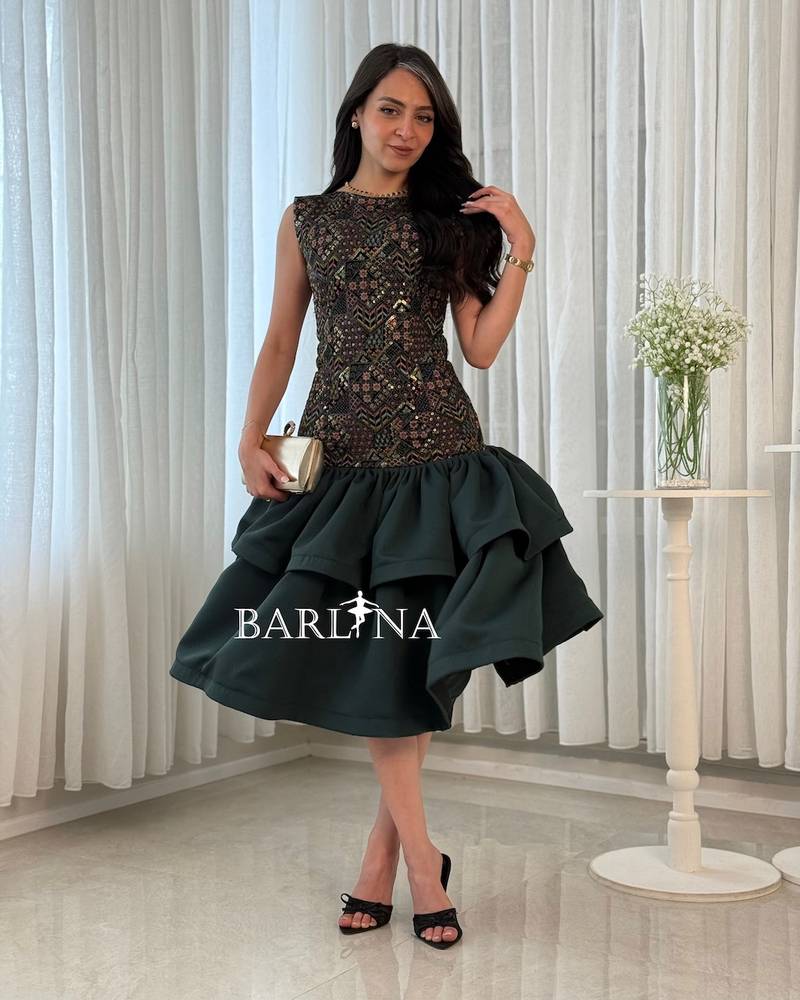 Green dress with layers and embroidery on top