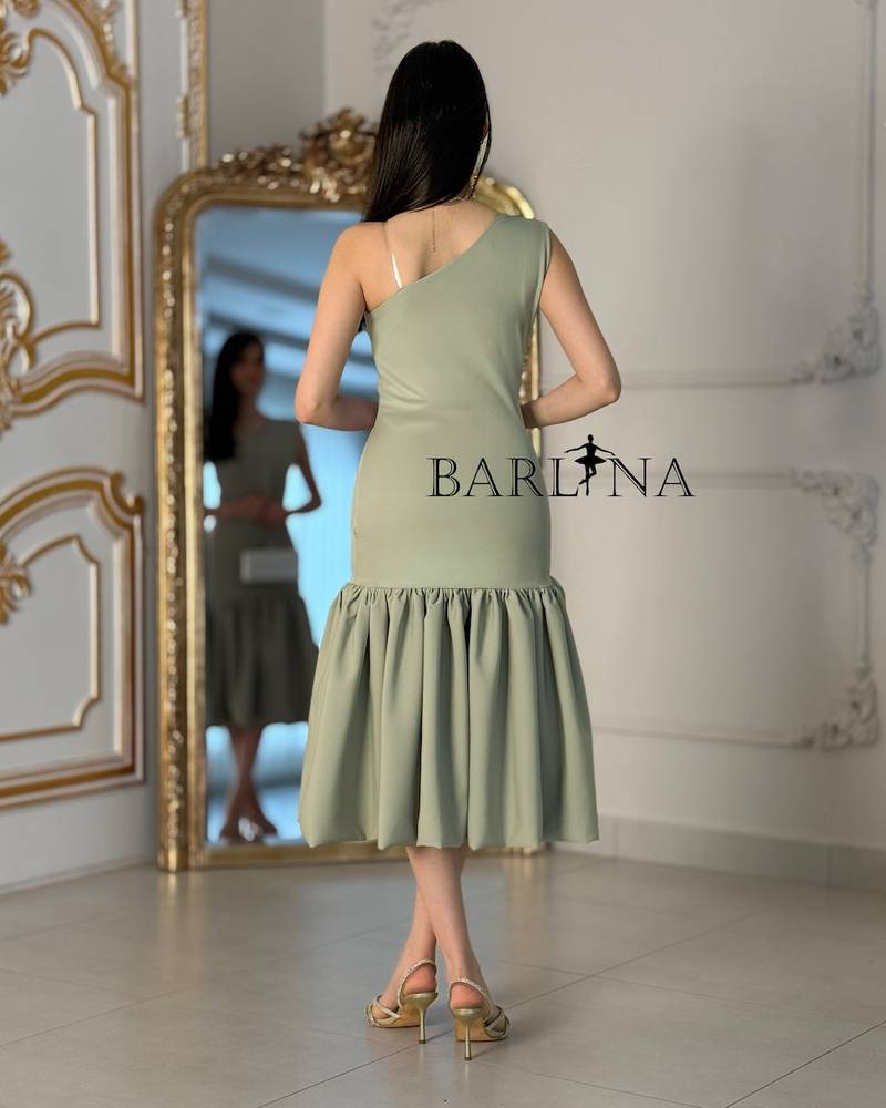 Light green one-shoulder dress with a ruffled hem