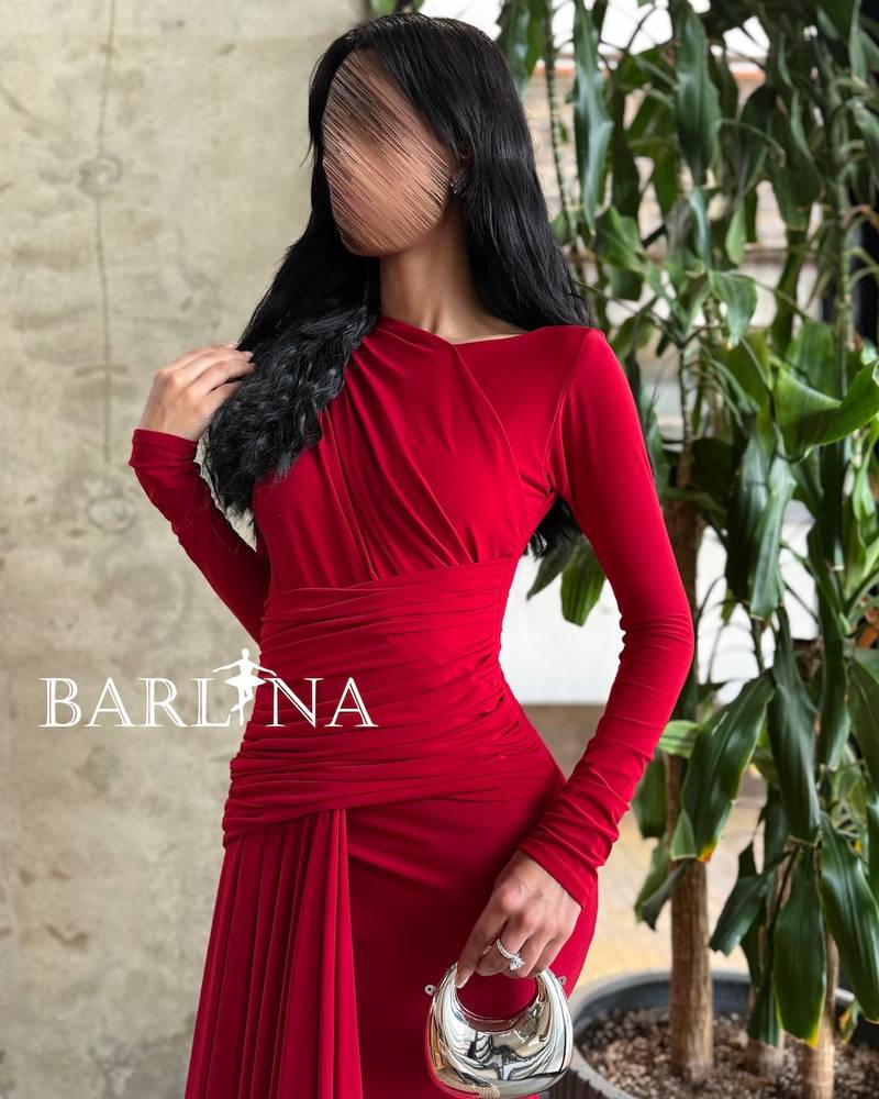 Long red draped dress with an extended tail