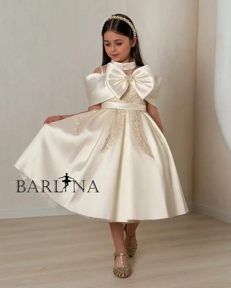 Beige girls' dress with a luxurious design and elegant embroidery