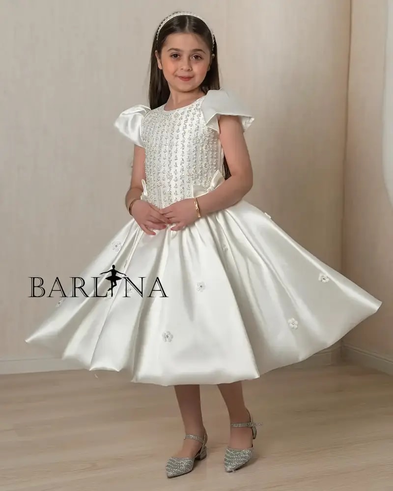Luxurious white girls' dress adorned with sparkling beads