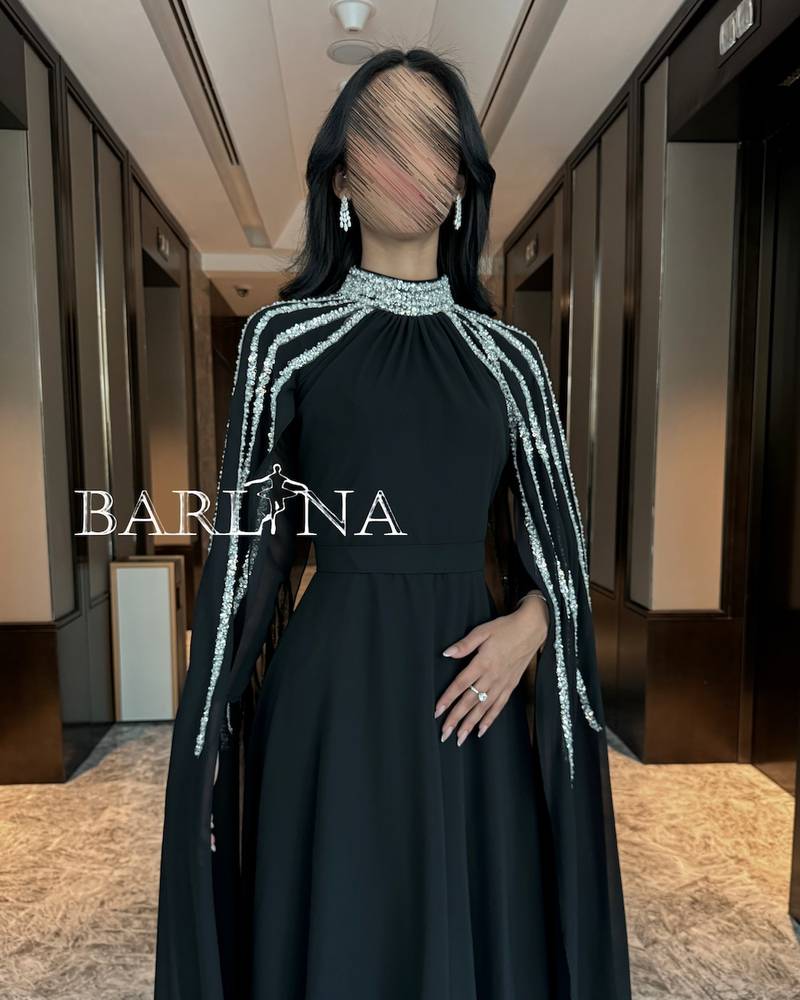 Long black chiffon cape dress decorated with sequins