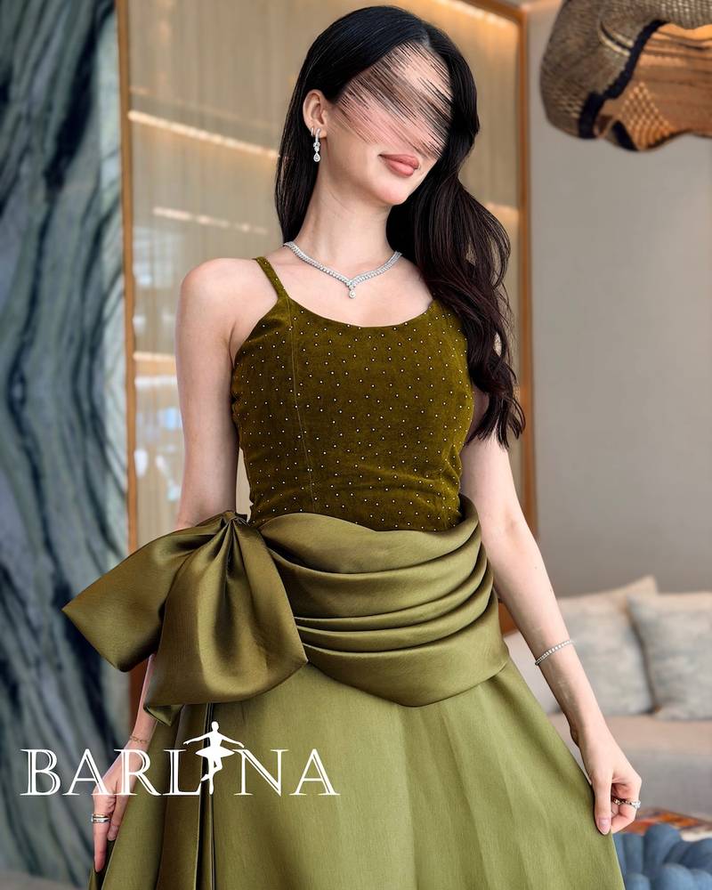 Olive green evening dress with a velvet bodice