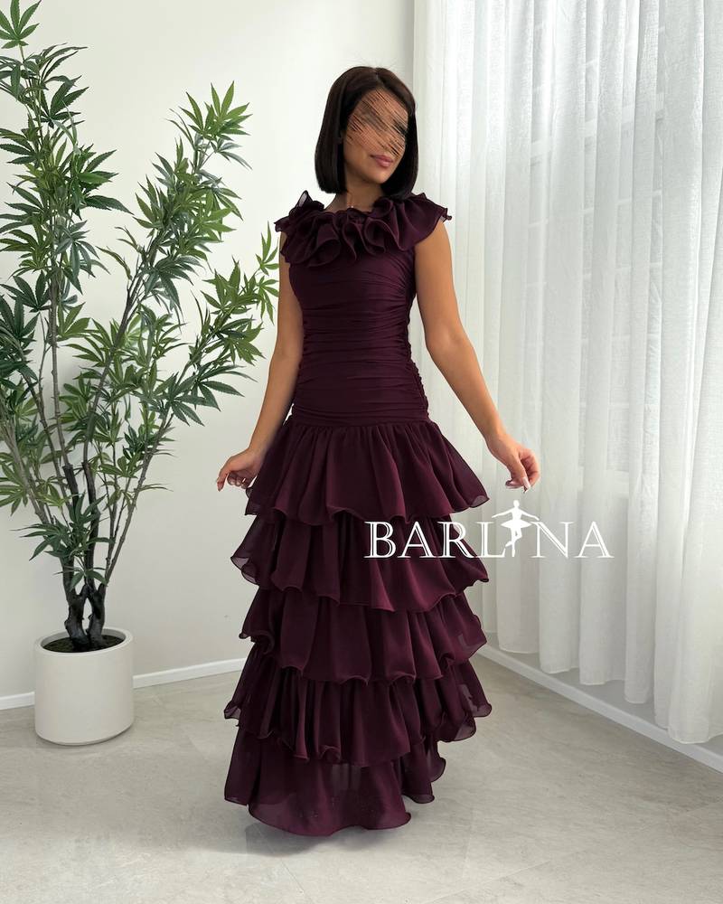 Burgundy dress with a ruffled collar and tiered layers