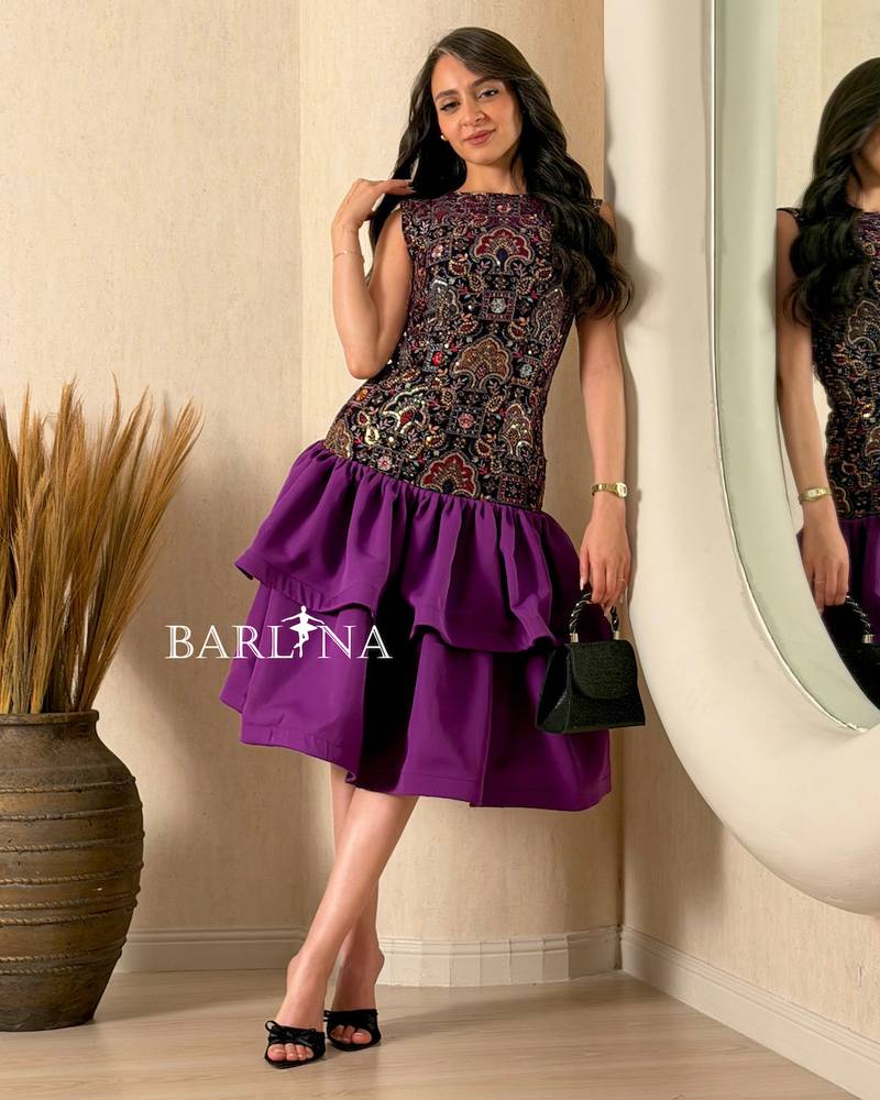 A soft dress with layers and embroidery on the top