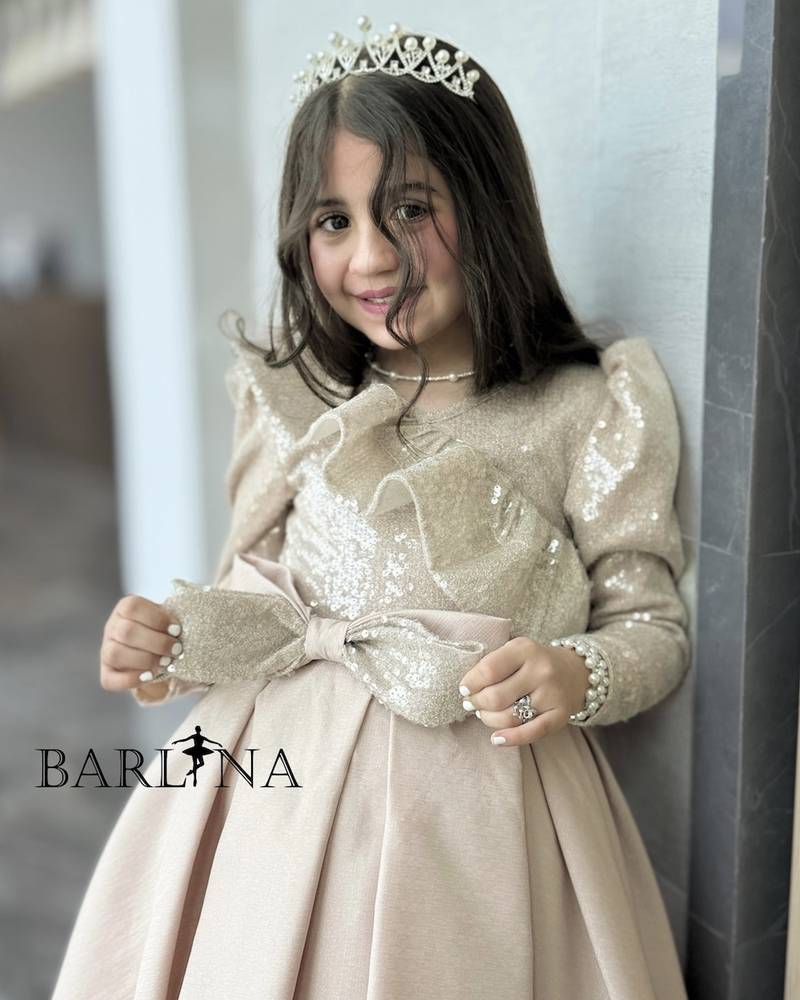 Beige girls' dress with a soft sequined sheen