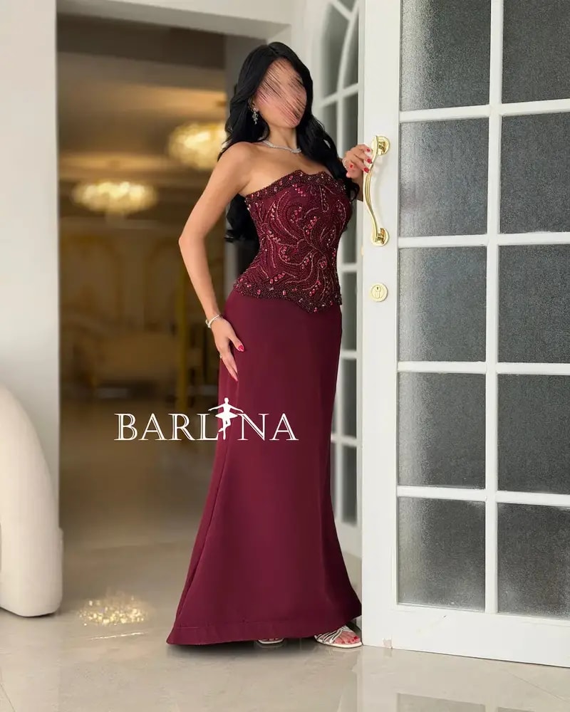 Burgundy evening dress with an embroidered corset design