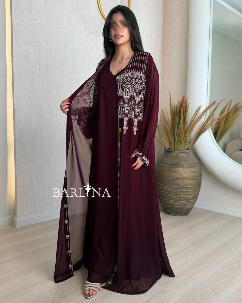 Burgundy jalabiya adorned with delicate embroidery on the chest