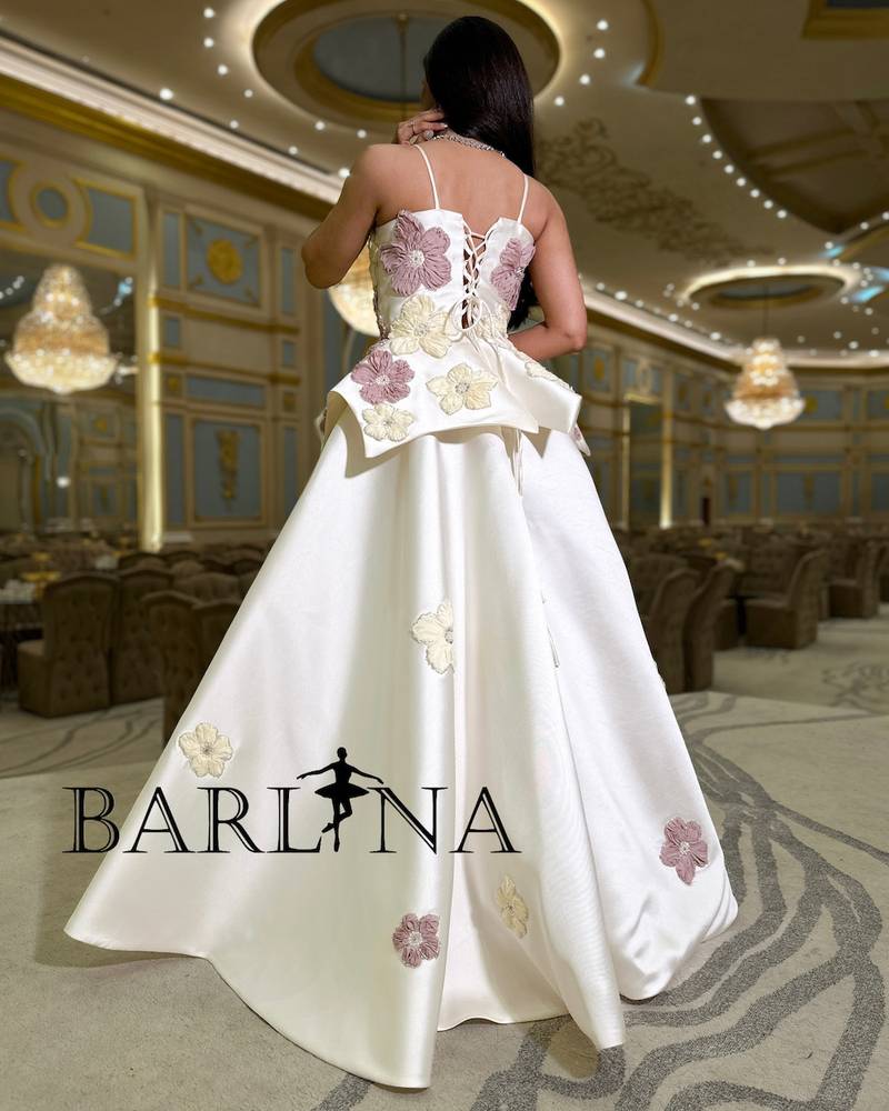 Ivory white dress with prominent embroidery