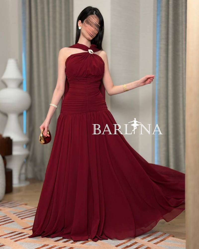 Burgundy dress with soft pleats and halter neck design