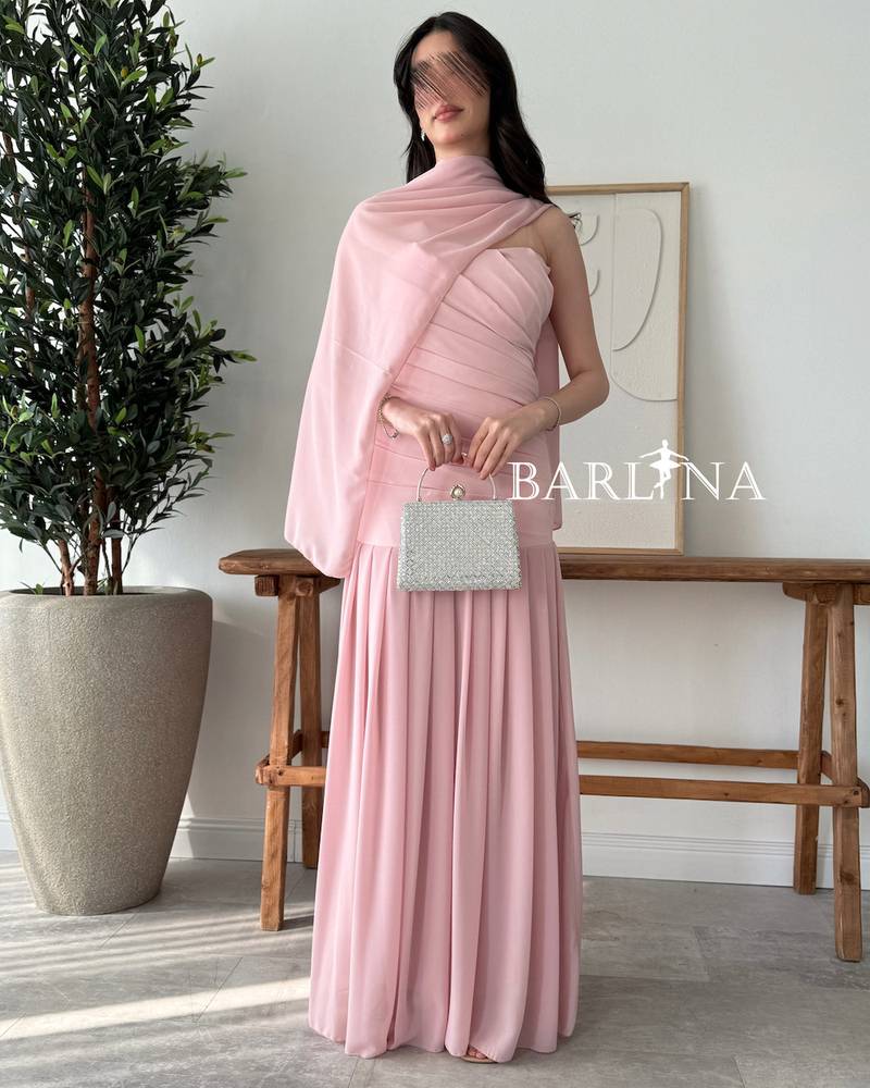 A soft pink dress with a matching shawl