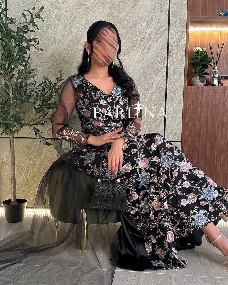 Black evening dress with shiny floral embroidery