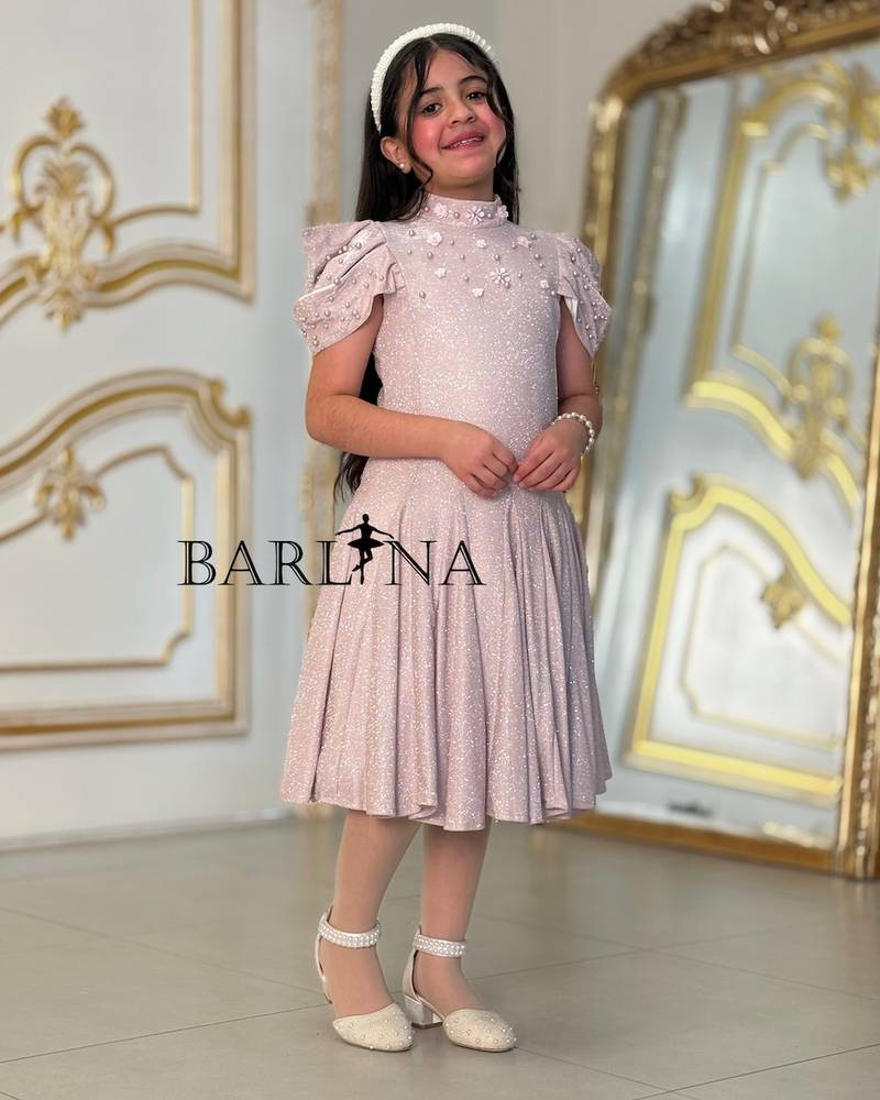 A sparkly girl's dress decorated with pearls