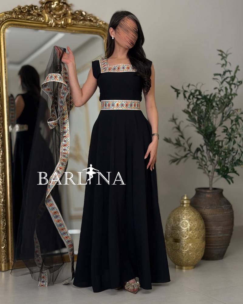 Black jalabiya with colorful traditional embroidery