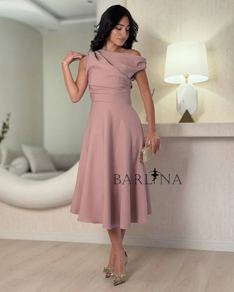 A pink midi dress with an elegant and soft design.