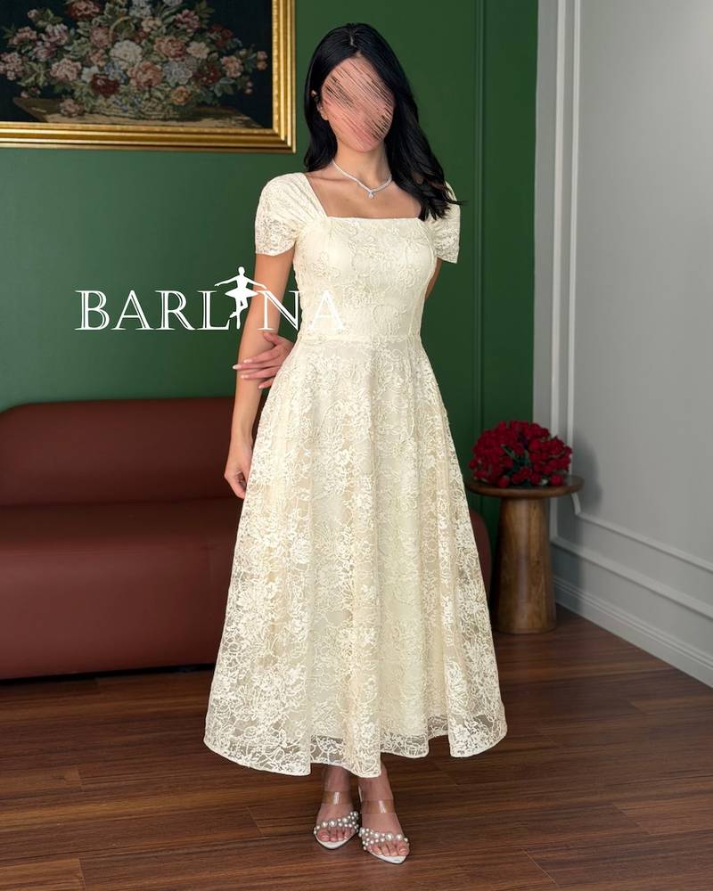 A dress made of soft off-white lace