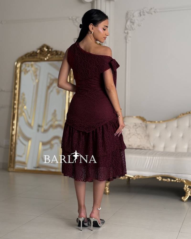 A dark burgundy dress made of fine lace