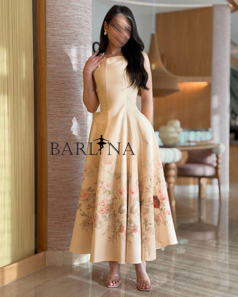 Beige dress adorned with delicate floral prints