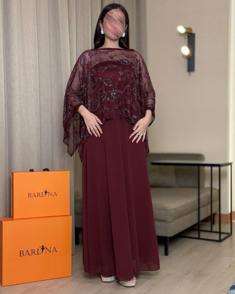 Elegant burgundy dress with a sheer embroidered panel.