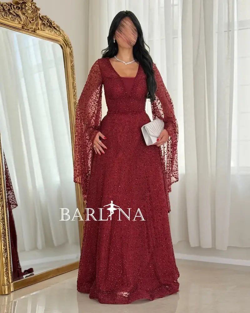 Red evening dress adorned with shimmering embroidery