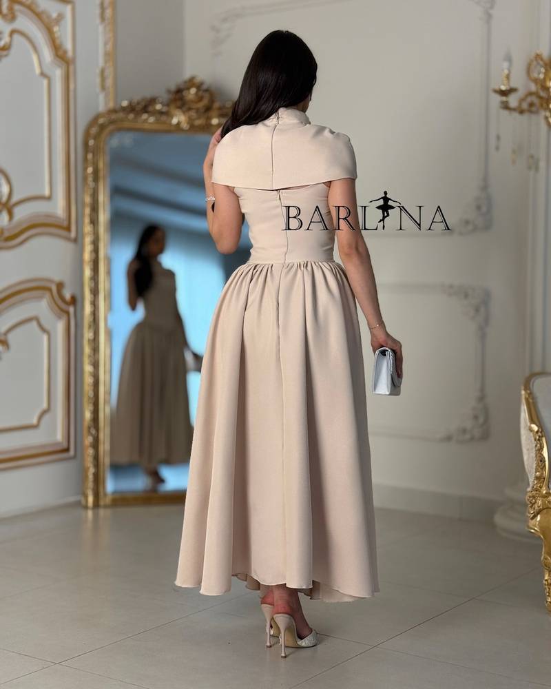 Beige flowing dress with a soft slit at the chest