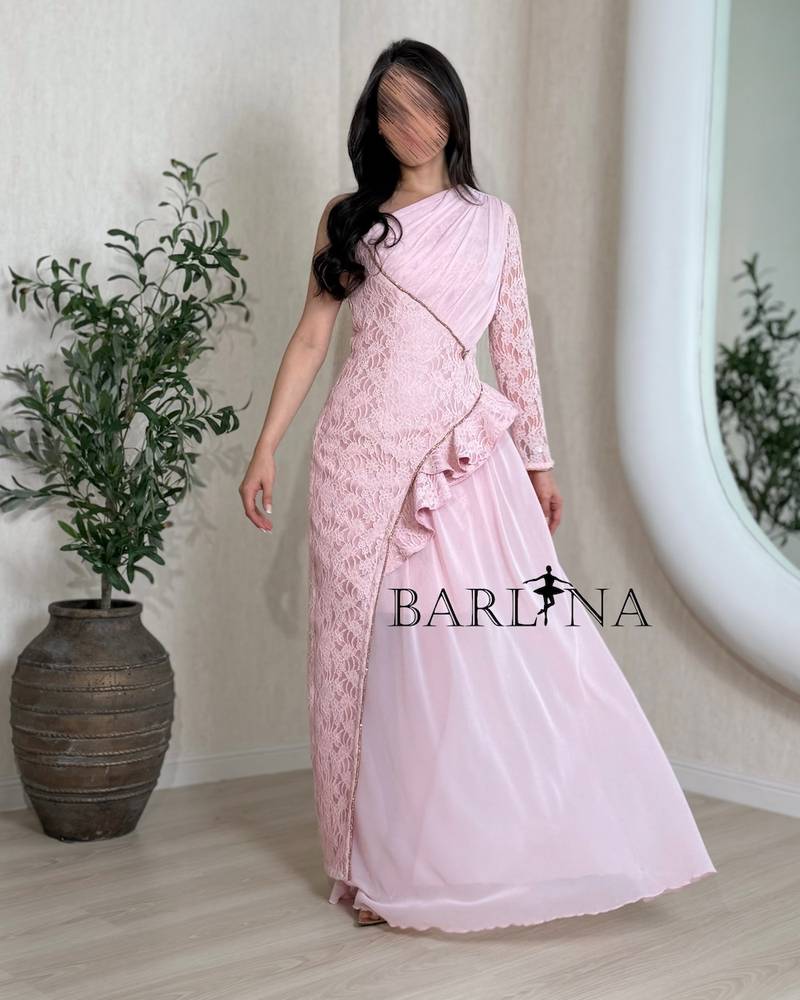 Soft pink dress with a ruffled waist and one sleeve