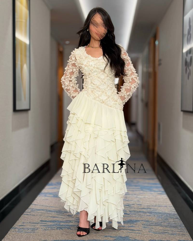 Soft off-white dress with rose embroidery and layers