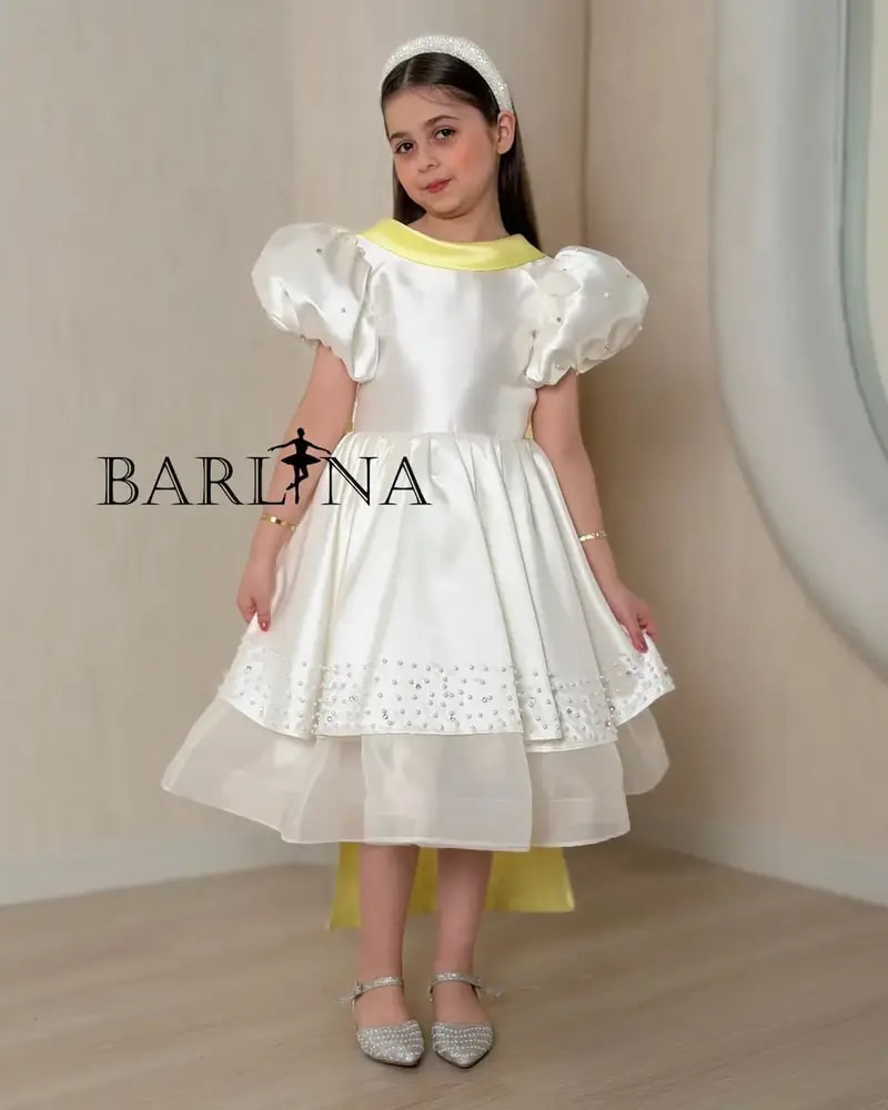 Girls' white evening dress with a yellow touch