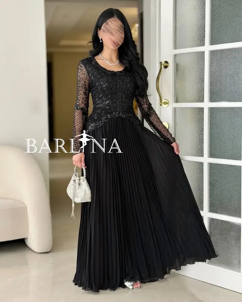 Luxurious black dress with embroidery on the top