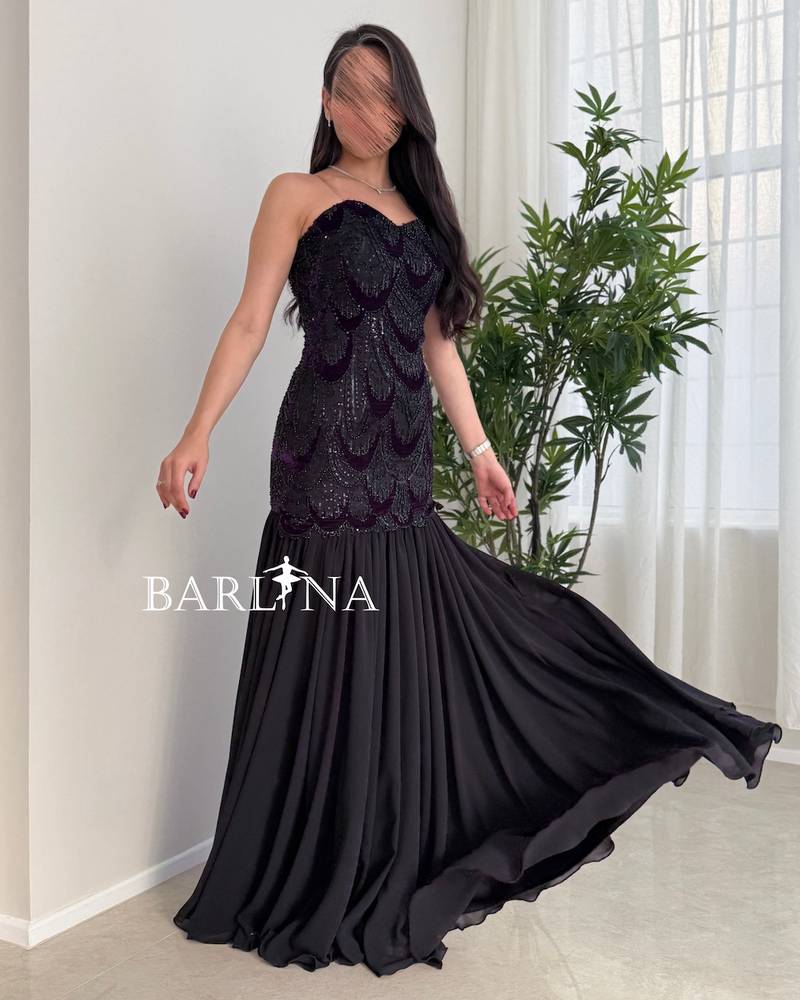Black dress with a sequined embroidered sweetheart neckline