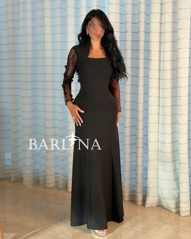 Black dress with sheer sleeves and an open back