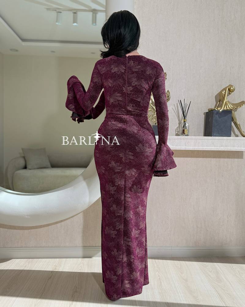 Burgundy dress with side pleats and a front slit