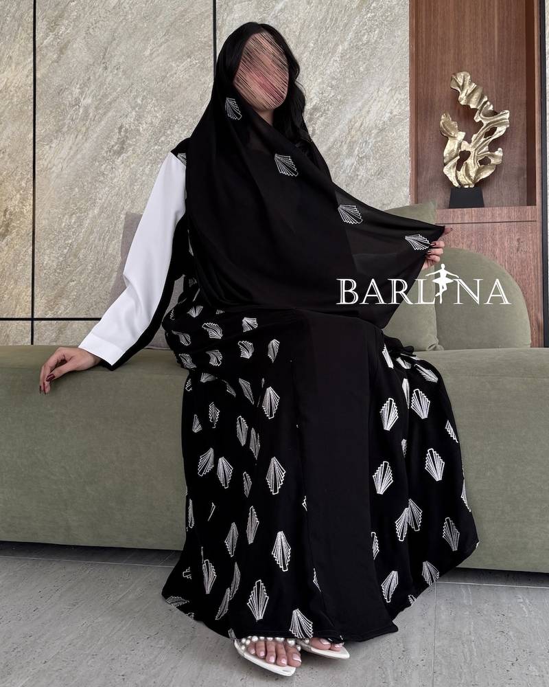 Elegant black abaya with white details